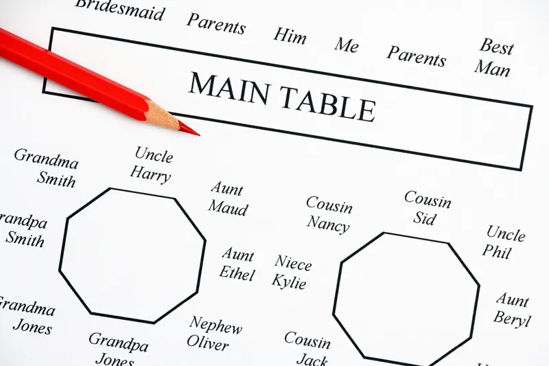 Overhead shot of a floor plan sketch on paper with pen and coffee